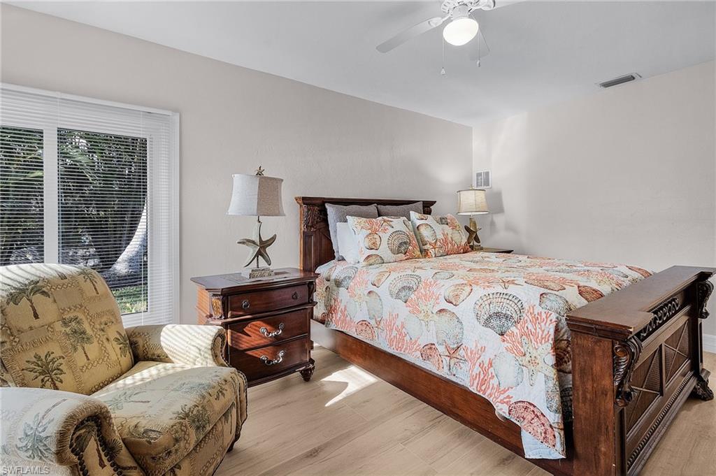 Bedroom featuring wood finished floors and a ceiling fan
