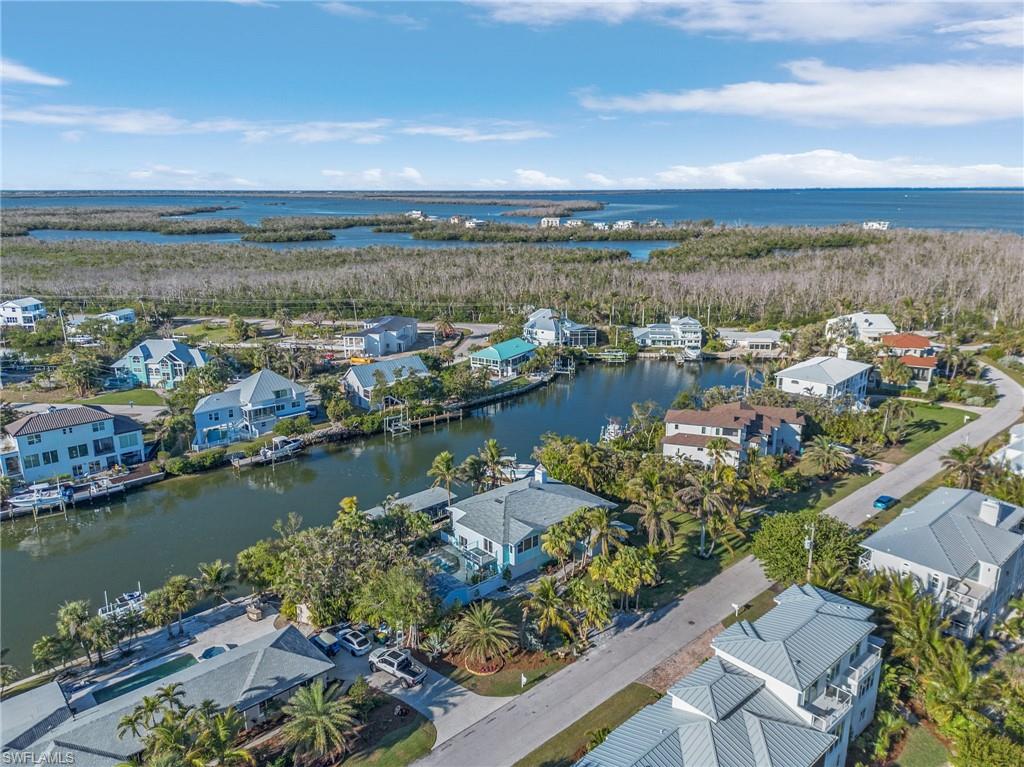 Aerial perspective of suburban area with a large body of water