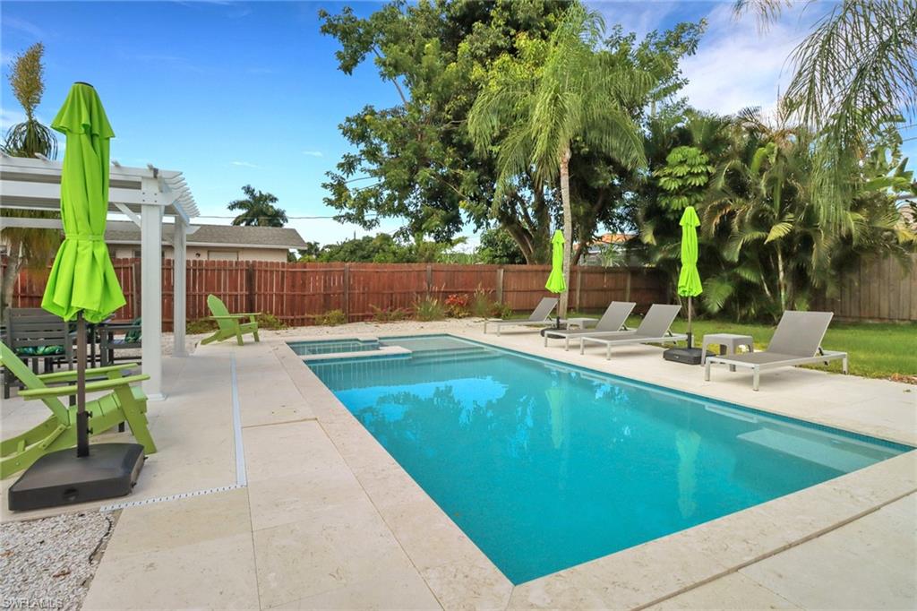 View of swimming pool featuring a pergola and a patio area