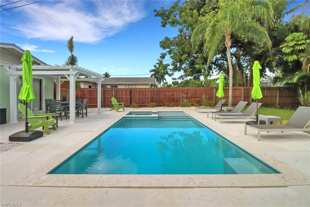 View of pool featuring a pergola and a patio