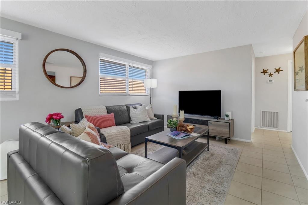 Living room featuring light tile patterned flooring