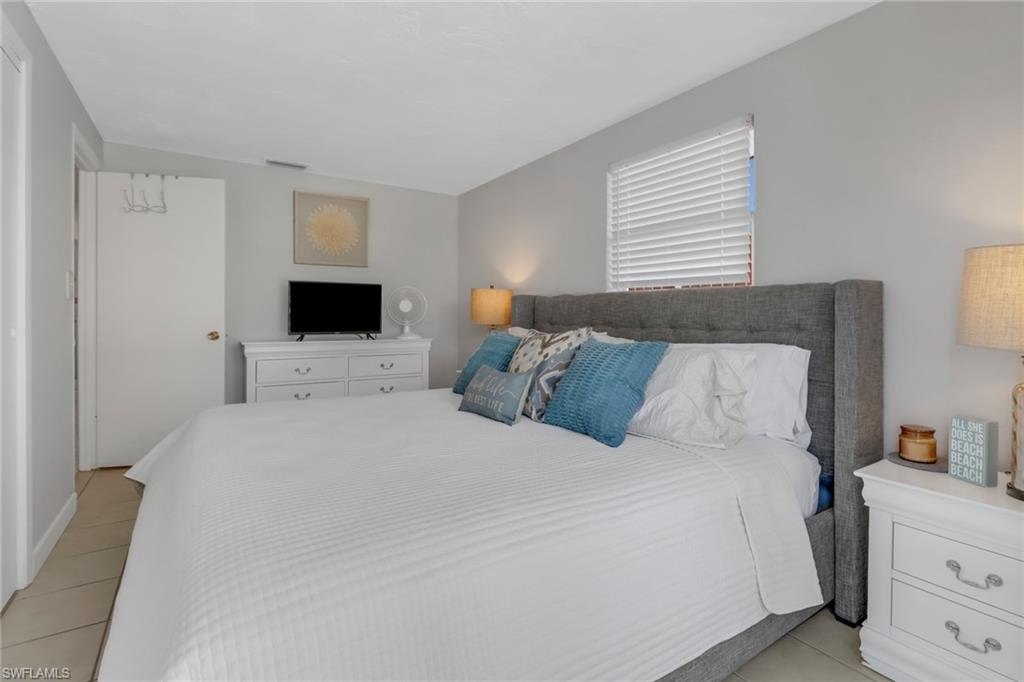 Bedroom with light tile patterned floors