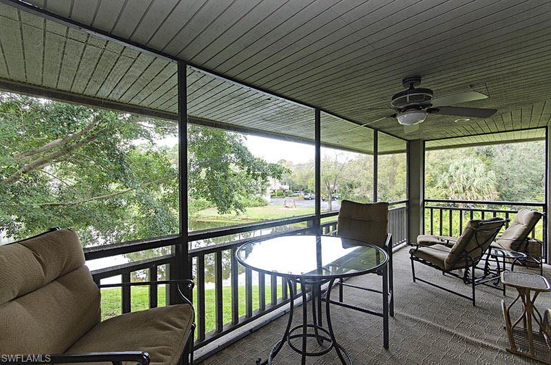 Sunroom with a ceiling fan