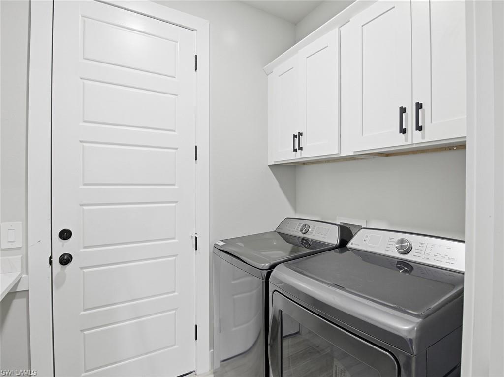 Laundry area with washing machine and dryer and cabinet space