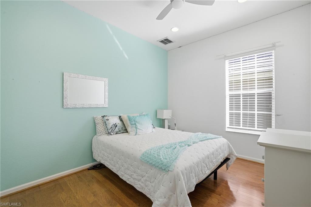 Bedroom featuring wood finished floors and ceiling fan