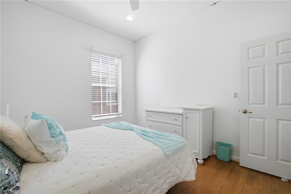 Bedroom featuring wood finished floors and a ceiling fan