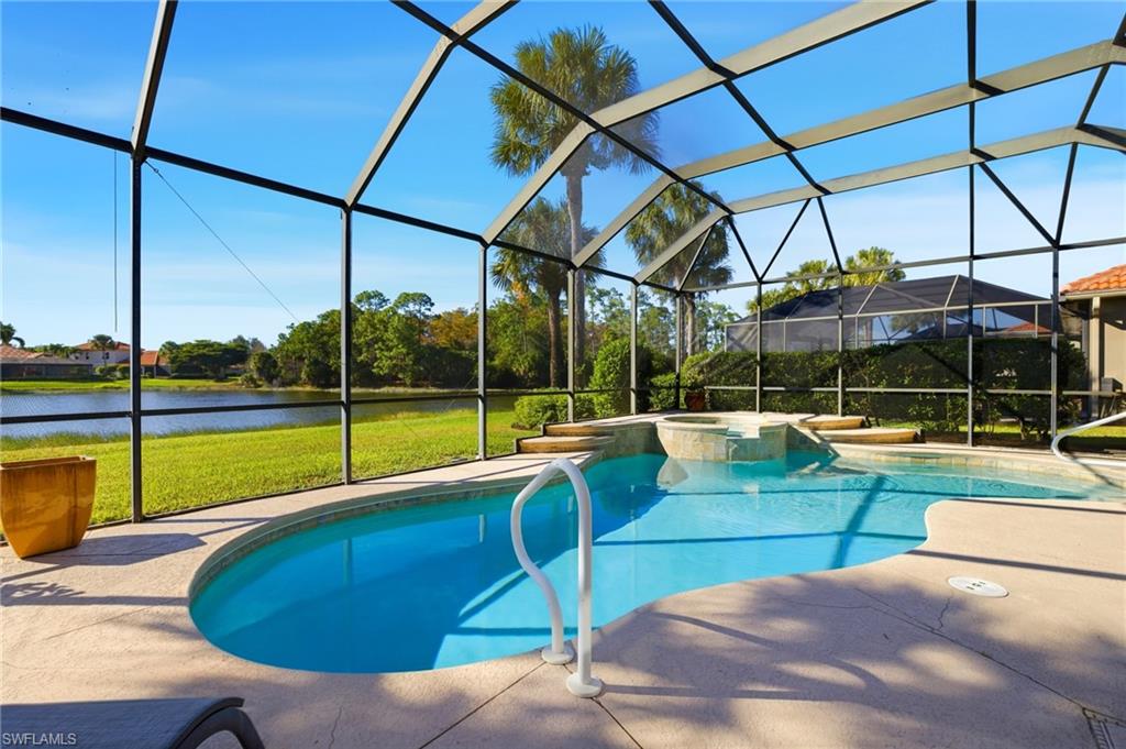 View of swimming pool with a lanai, a sunroom, a patio, a yard, and a water view