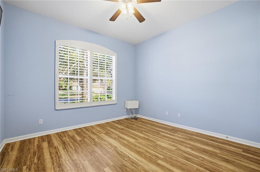 Spare room featuring wood finished floors and ceiling fan