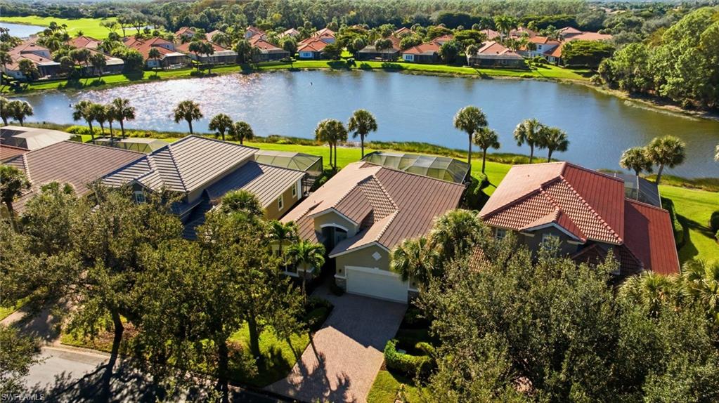 Aerial perspective of suburban area with a nearby body of water