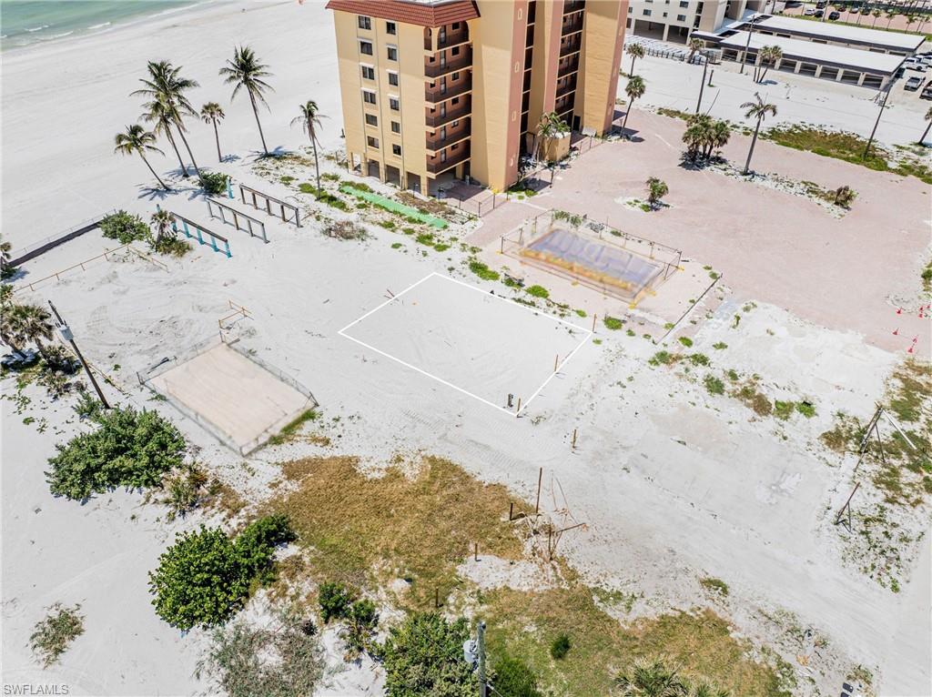 Drone / aerial view of local beach and apartment complex