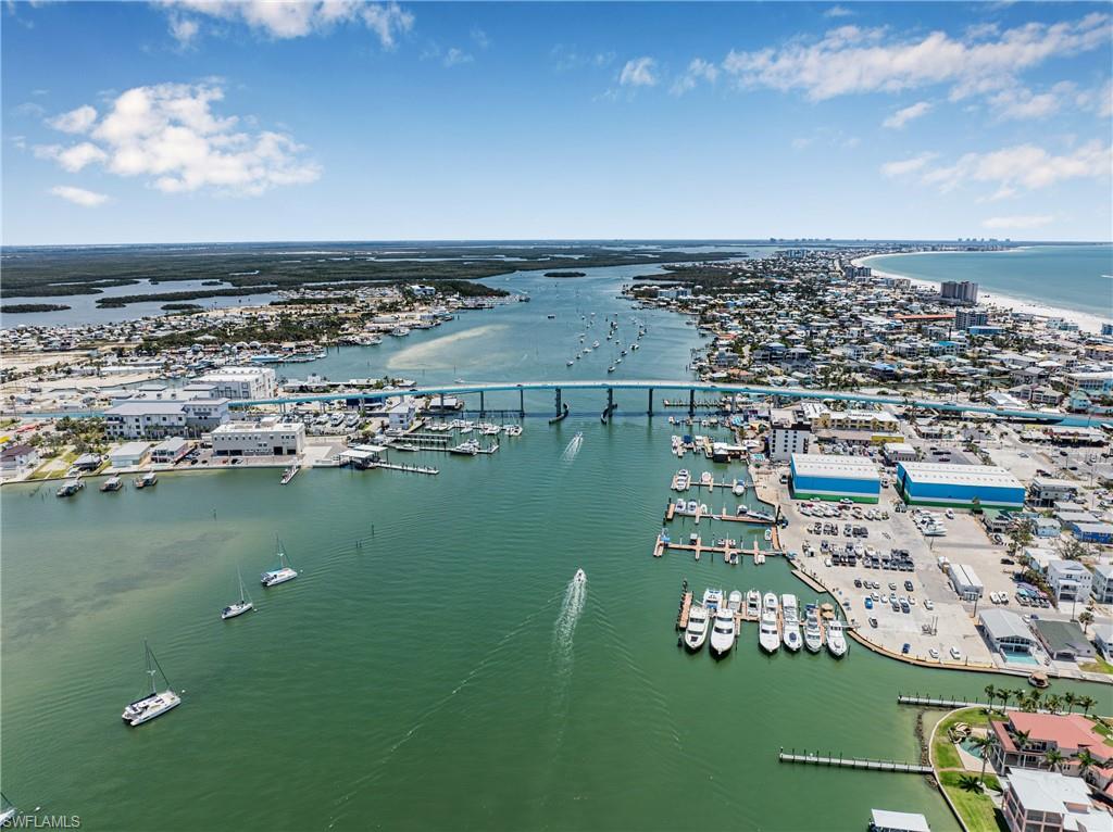 Aerial view of numerous boat docks and a nearby body of water