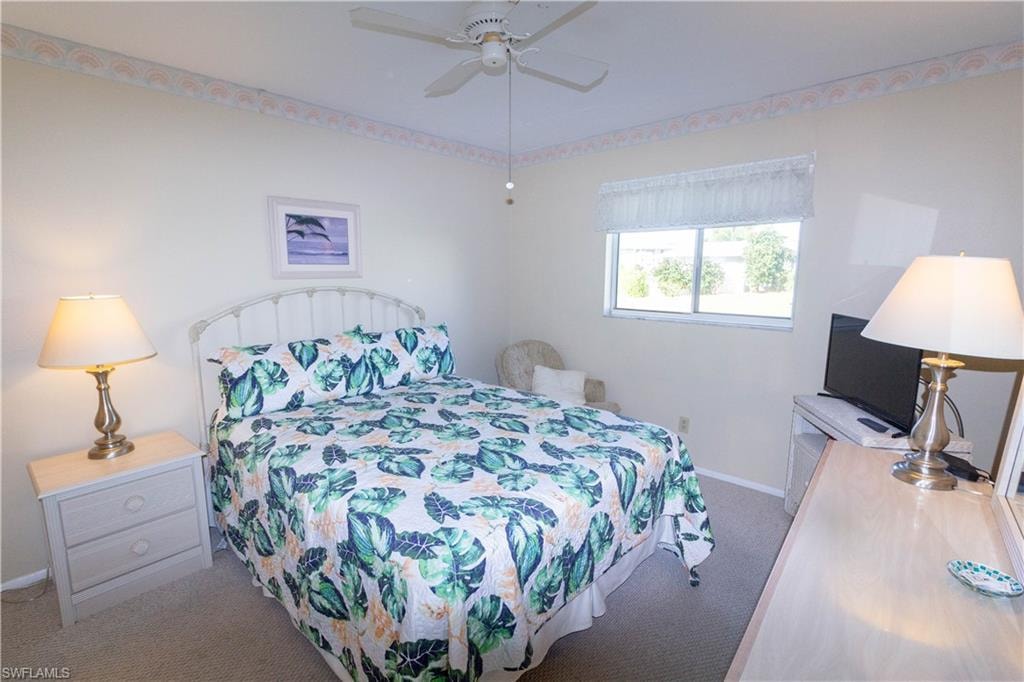 Bedroom featuring carpet and ceiling fan