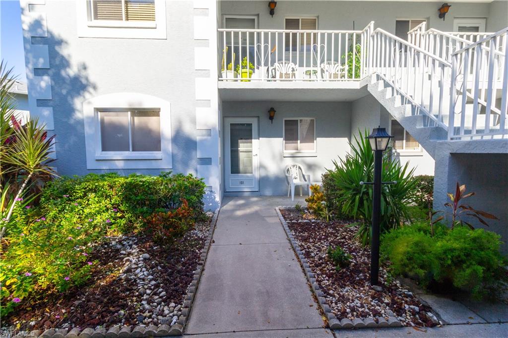Property entrance featuring stucco siding