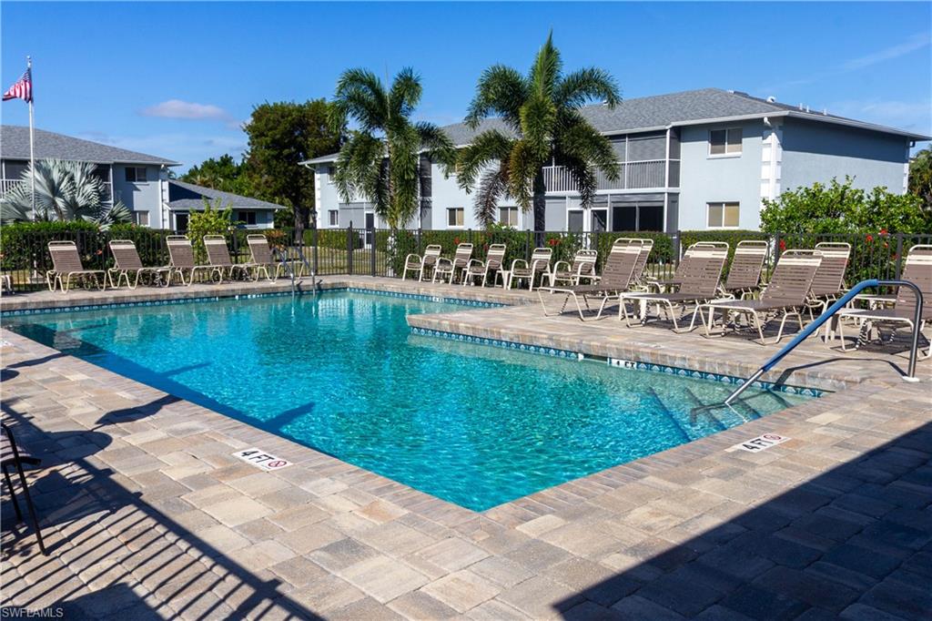 Community pool featuring a patio