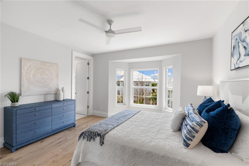 Bedroom with light wood-type flooring and ceiling fan