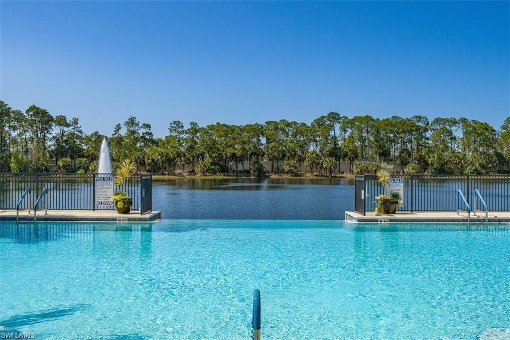 Infinity edge pool at clubhouse by lake