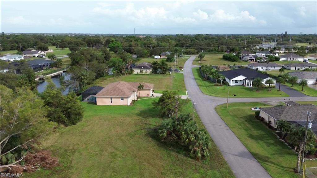 Aerial overview of property's location with nearby suburban area