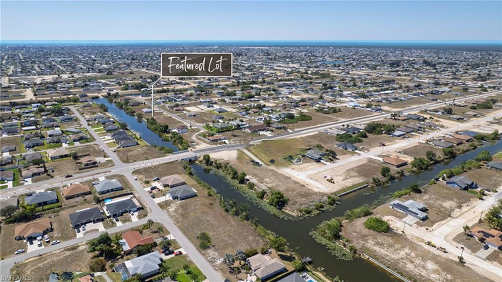 View of property location with nearby suburban area and a large body of water