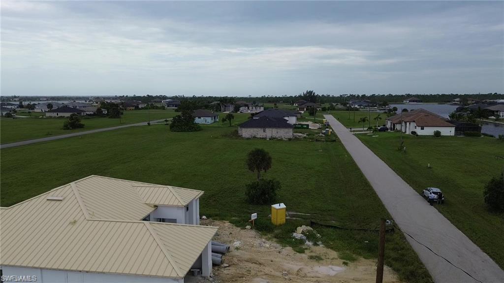 Aerial view of sparsely populated area featuring nearby suburban area