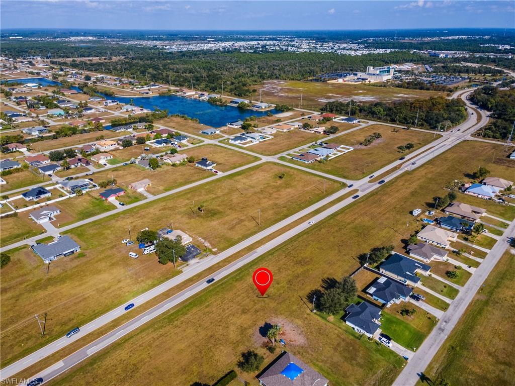 Aerial overview of property's location featuring nearby suburban area