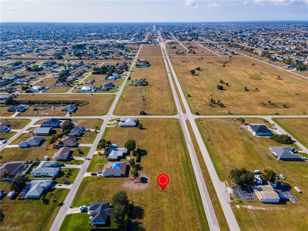 Aerial overview of property's location with nearby suburban area