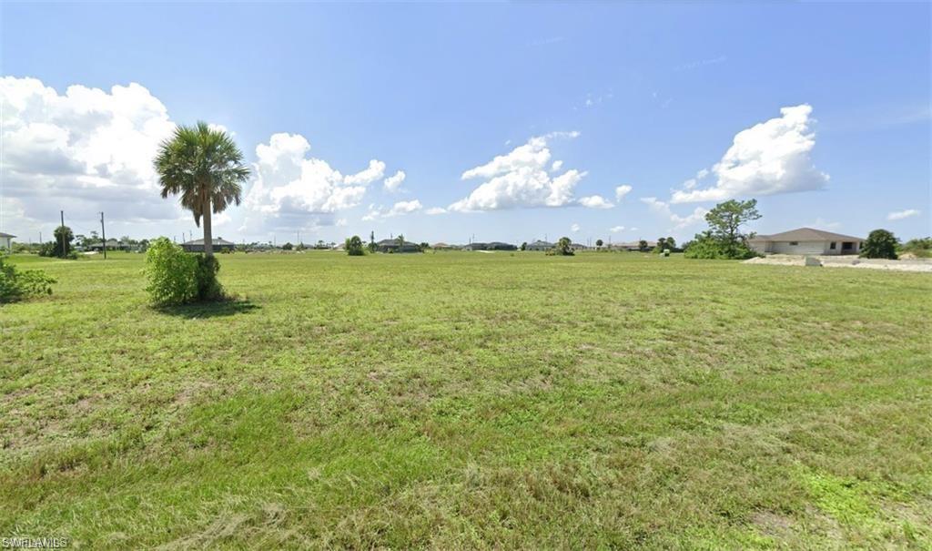View of green lawn featuring a rural view