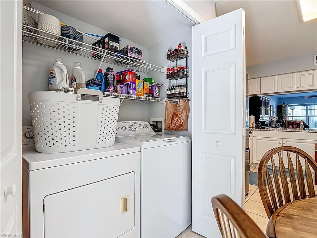 Laundry area featuring washing machine and clothes dryer