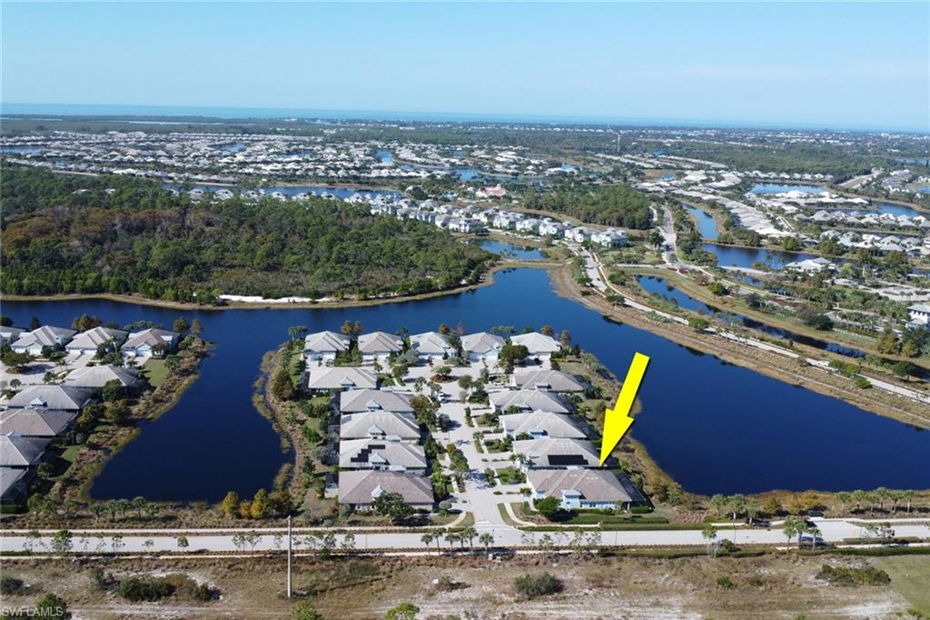View of property location with a large body of water and nearby suburban area