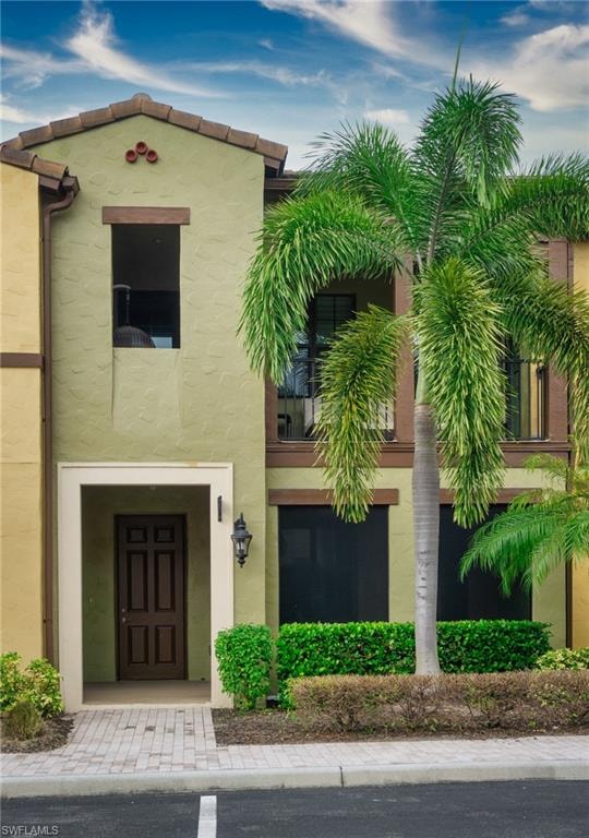 View of front of house with stucco siding