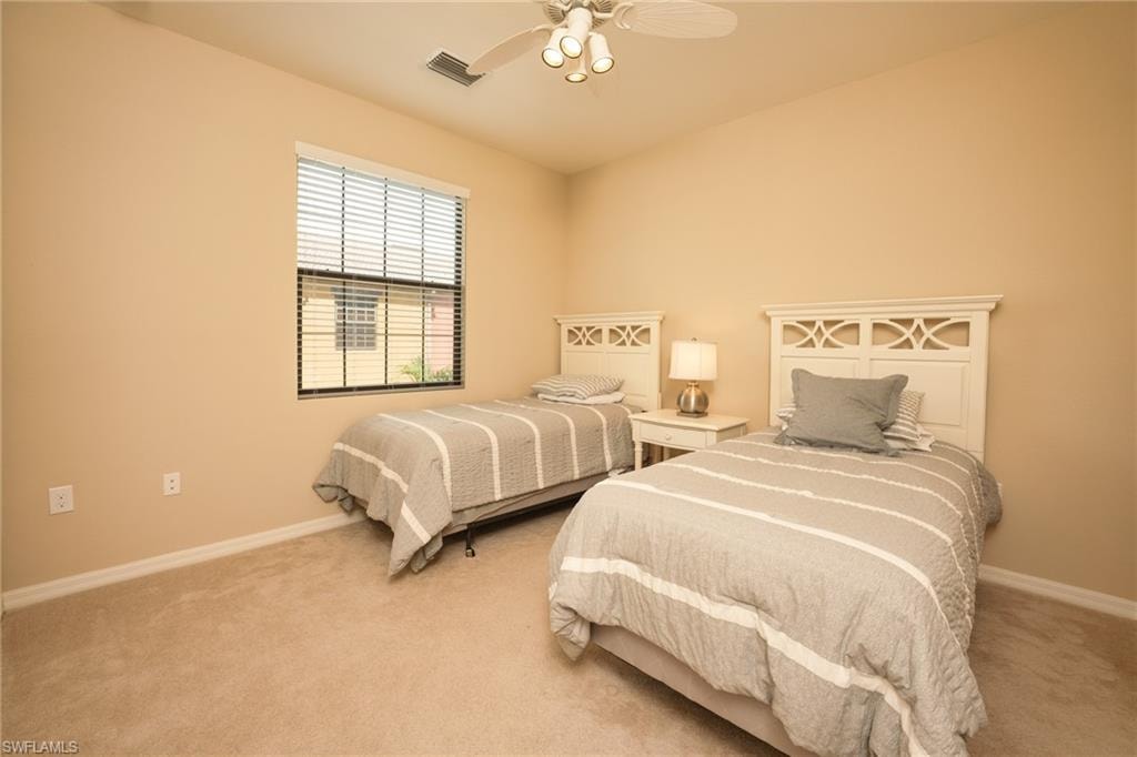 Bedroom with carpet flooring and ceiling fan