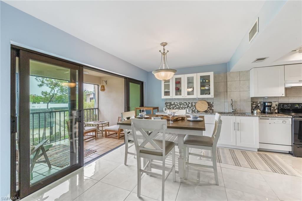 Kitchen / dining with view to lanai & pond