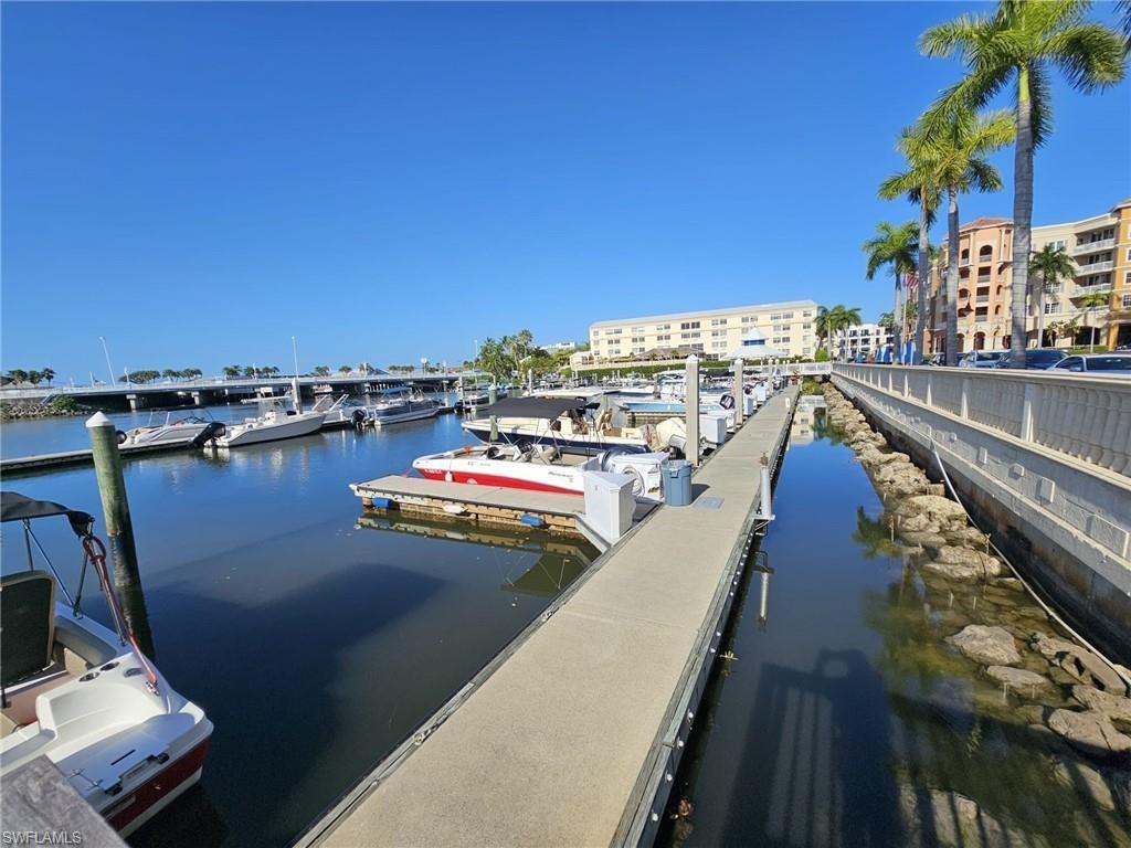 Dock area featuring a water view