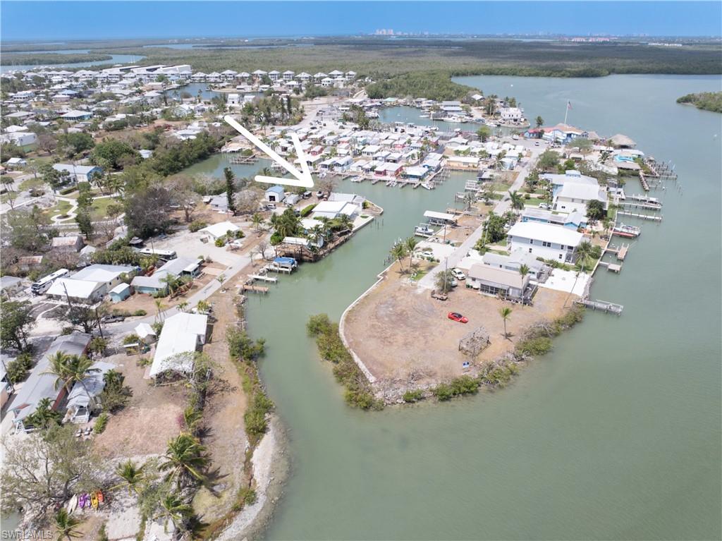 Aerial overview of property's location with a large body of water