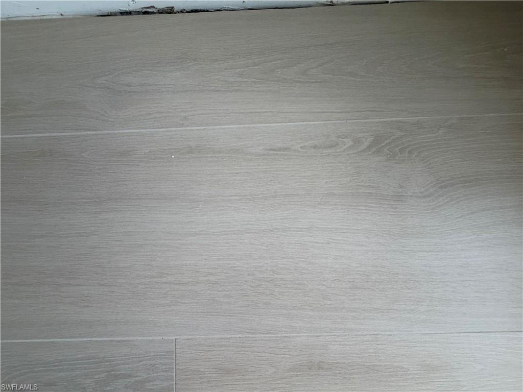 New Flooring tile installed throughout condo and on balconies.