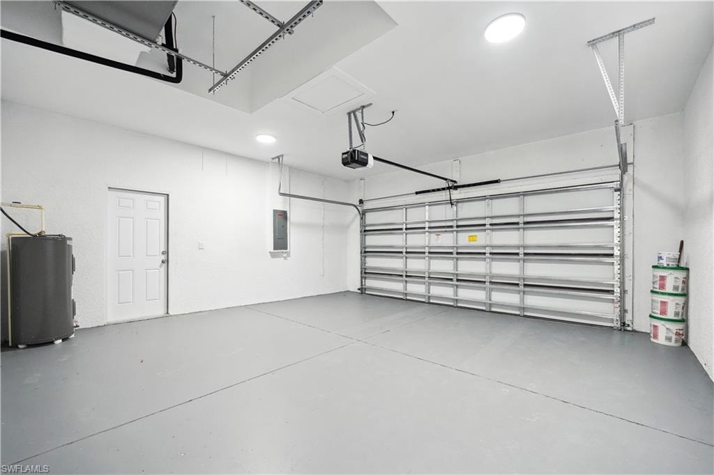 Garage with electric water heater and electric panel