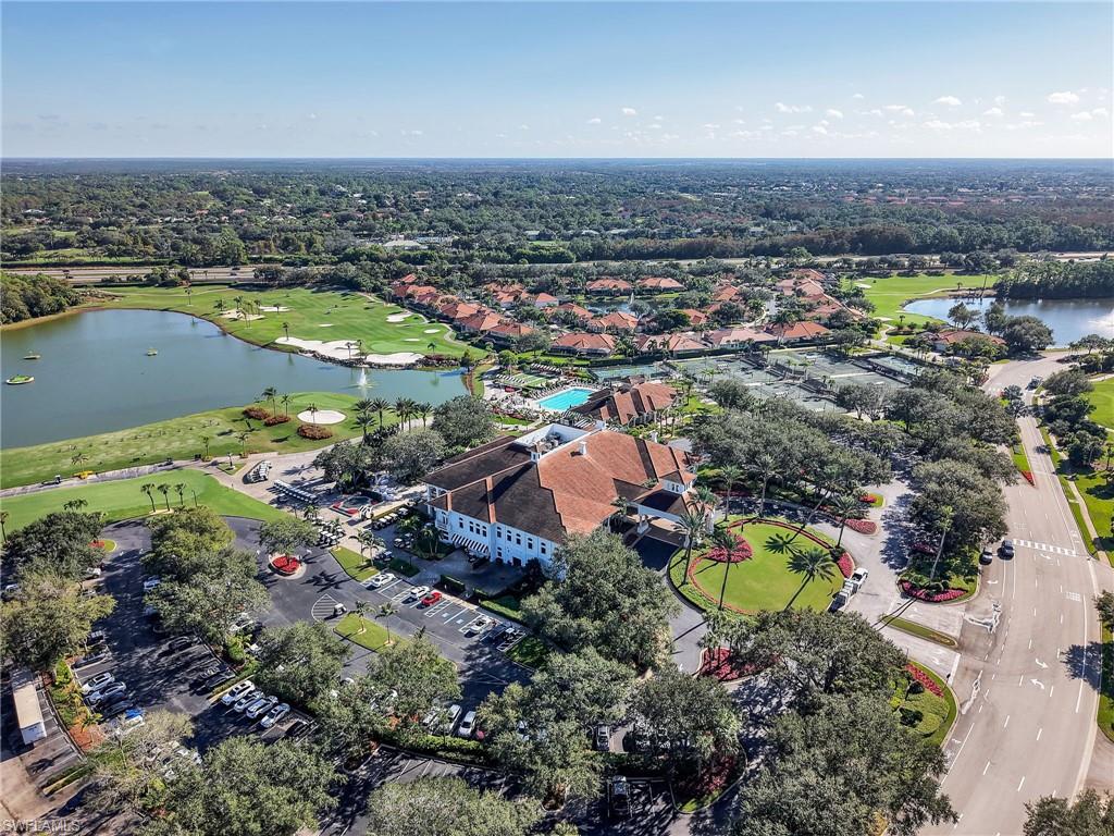 Drone / aerial view of a large body of water and a golf course