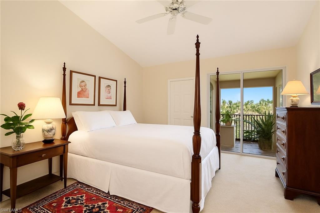 Bedroom with access to lanai, ceiling fan, light colored carpet, and vaulted ceiling, digitally altered