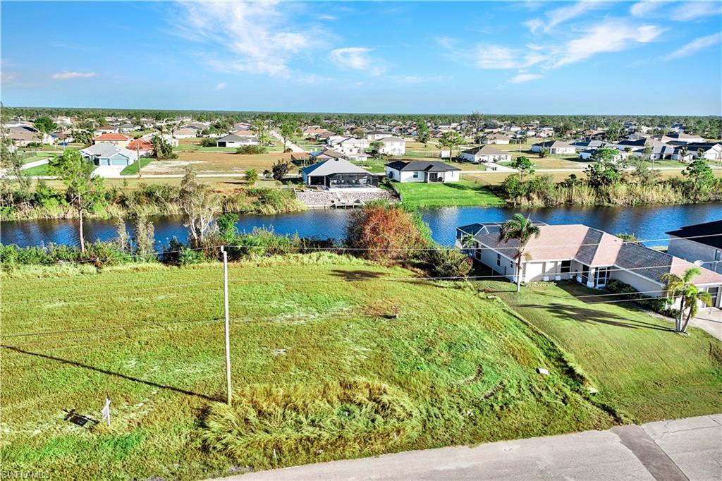 Aerial view of residential area with a large body of water