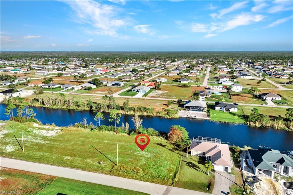 Aerial view of residential area with a nearby body of water