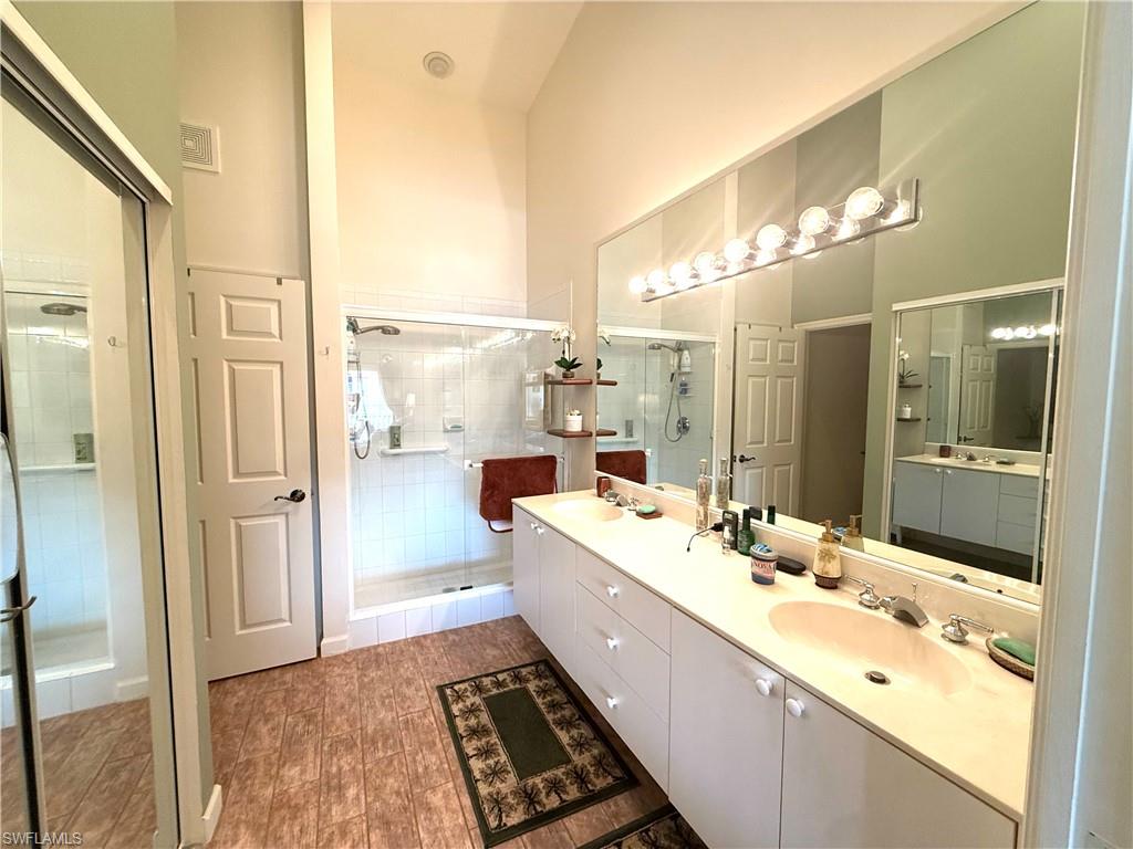 Primary bathroom has dual sinks, walk-in and linen closets