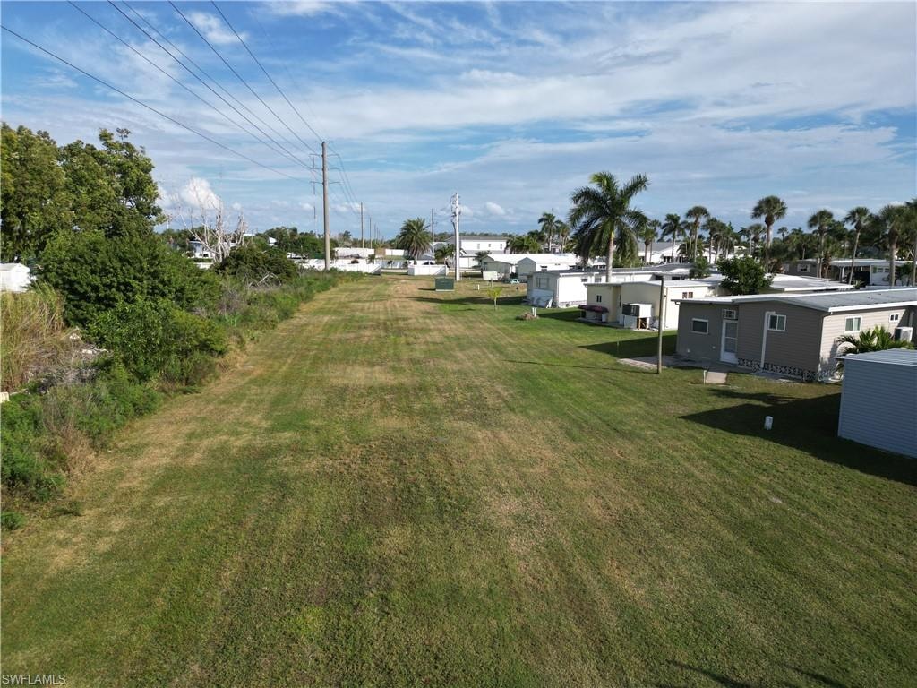 Looking North across the large grassy area to the rear of the lot