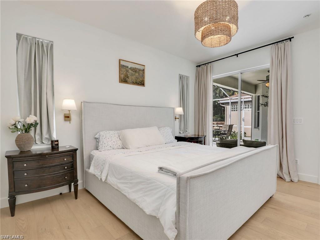 Bedroom featuring access to outside and wood finished floors