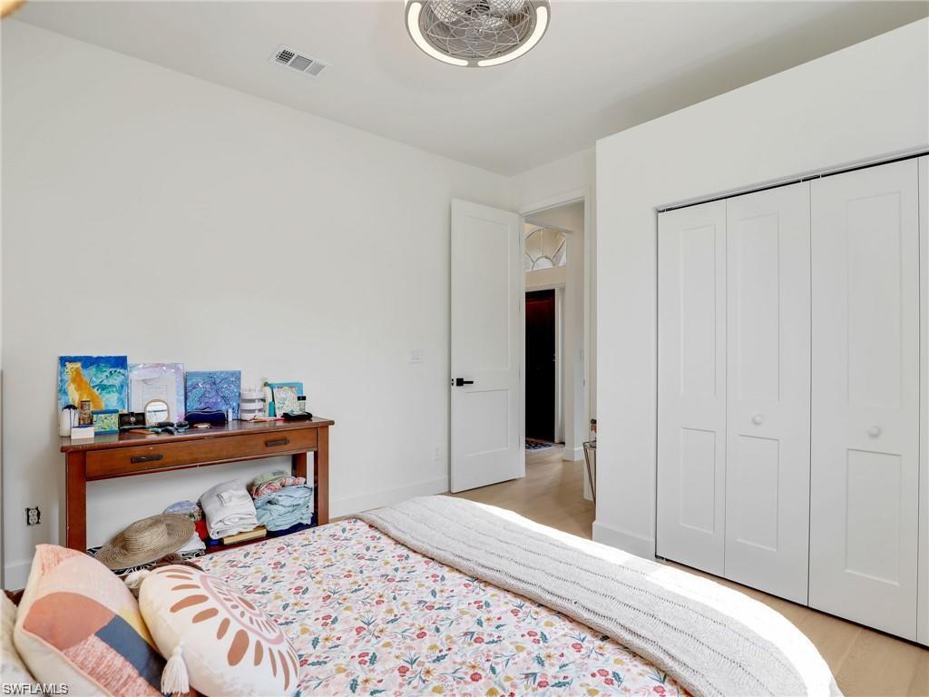 Bedroom featuring a closet and light wood-style flooring