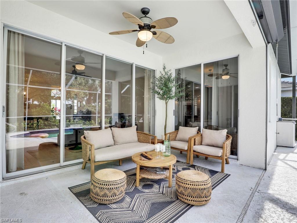 View of patio with an outdoor living space and a ceiling fan