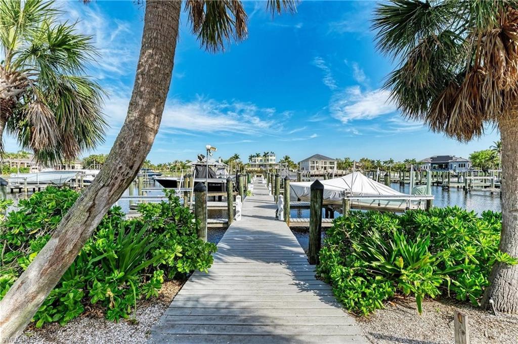 Dock featuring boat lift and a water view
