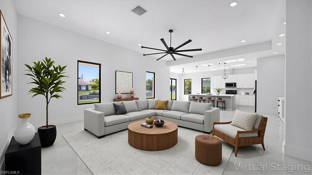 Living area with recessed lighting and ceiling fan