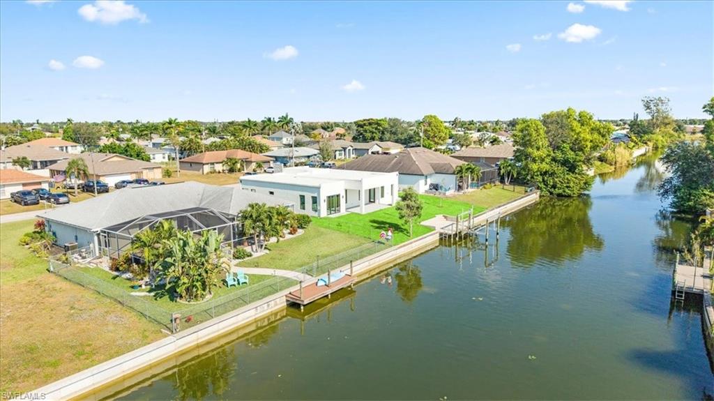 Aerial perspective of suburban area with a large body of water