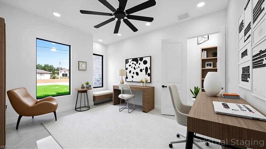 Office space with recessed lighting, concrete floors, and a ceiling fan