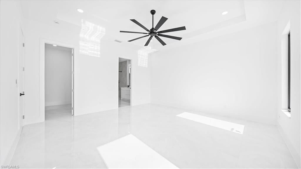 Empty room featuring recessed lighting and a ceiling fan