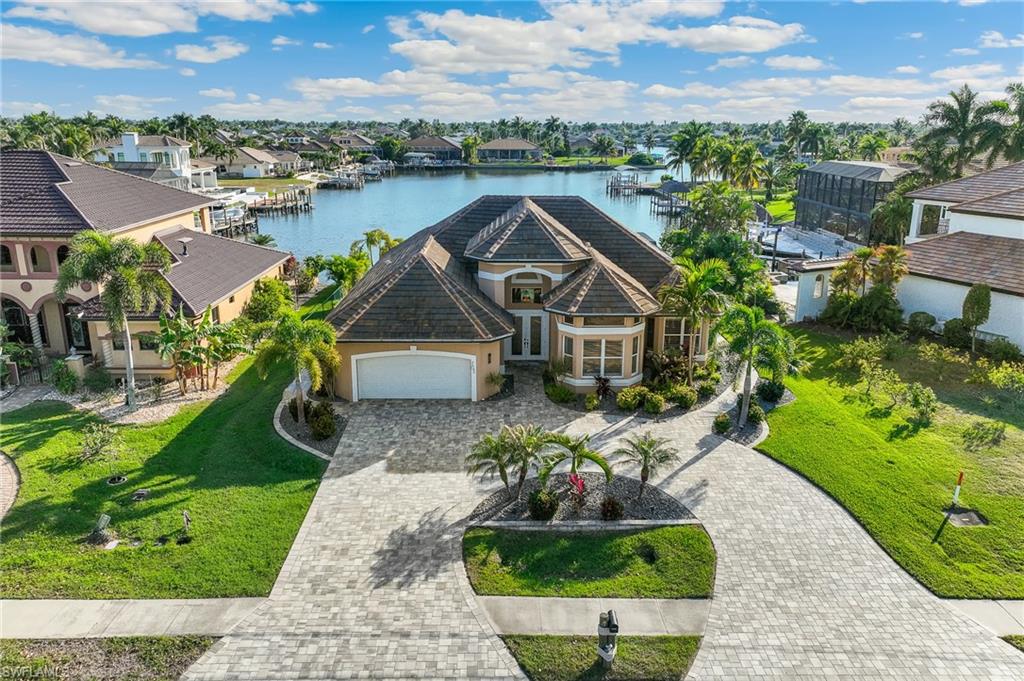 Aerial perspective of suburban area with a large body of water